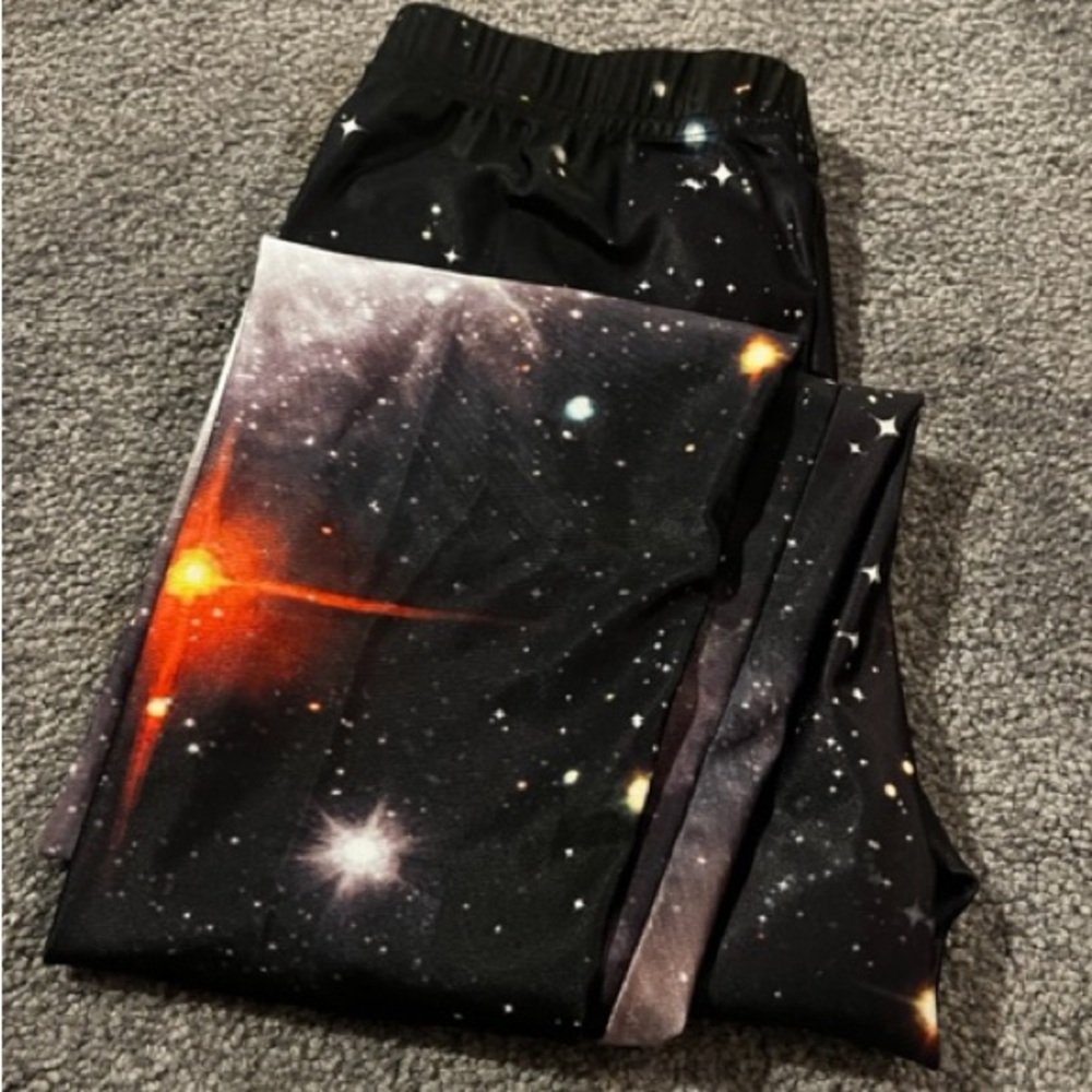 Galaxy leggings size M but is more like a small .NWT never worn boho goth